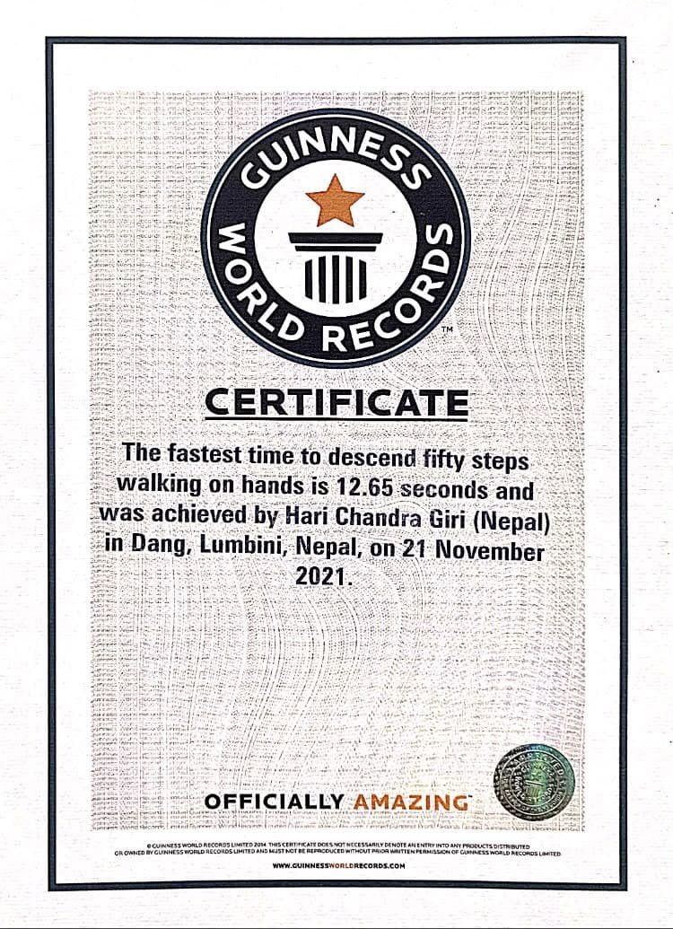 Guinness World Records certificate — Fastest time to descend 50 stairs walking on hands